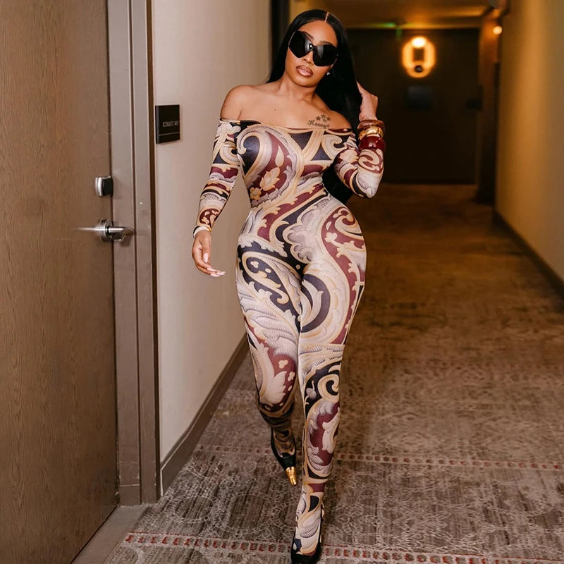 DRAPED PANT JUMPSUIT WITH HARDWARE BASKED IN BAROQUE